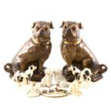 A pair of Staffordshire style Pugs, and other dog figures.