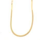 A yellow metal flexible collar necklace marked 14K