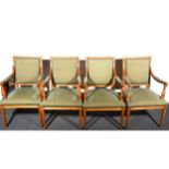 A set of eight French style beechwood elbow chairs, upholstered backs, arm pads and seats, reeded