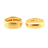 Two 22 carat yellow gold wedding bands.
