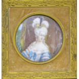 A circular portrait miniature of Queen Charlotte.