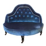 A Victorian conversation seat, upholstered in buttoned blue dralon, bowfronted seat, on turned