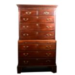 A George III mahogany chest on chest, dentil moulded cornice, blind fretwork frieze, upper section