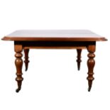 A Victorian mahogany wind-out dining table