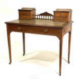 A late Victorian inlaid rosewood writing table