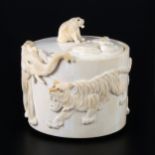 A Japanese carved and stained ivory box, early 20th Century
