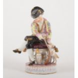 A Meissen porcelain figure of a boy with a puppy