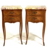 A pair of Louis XV style kingwood serpentine bedside tables, late 20th Century