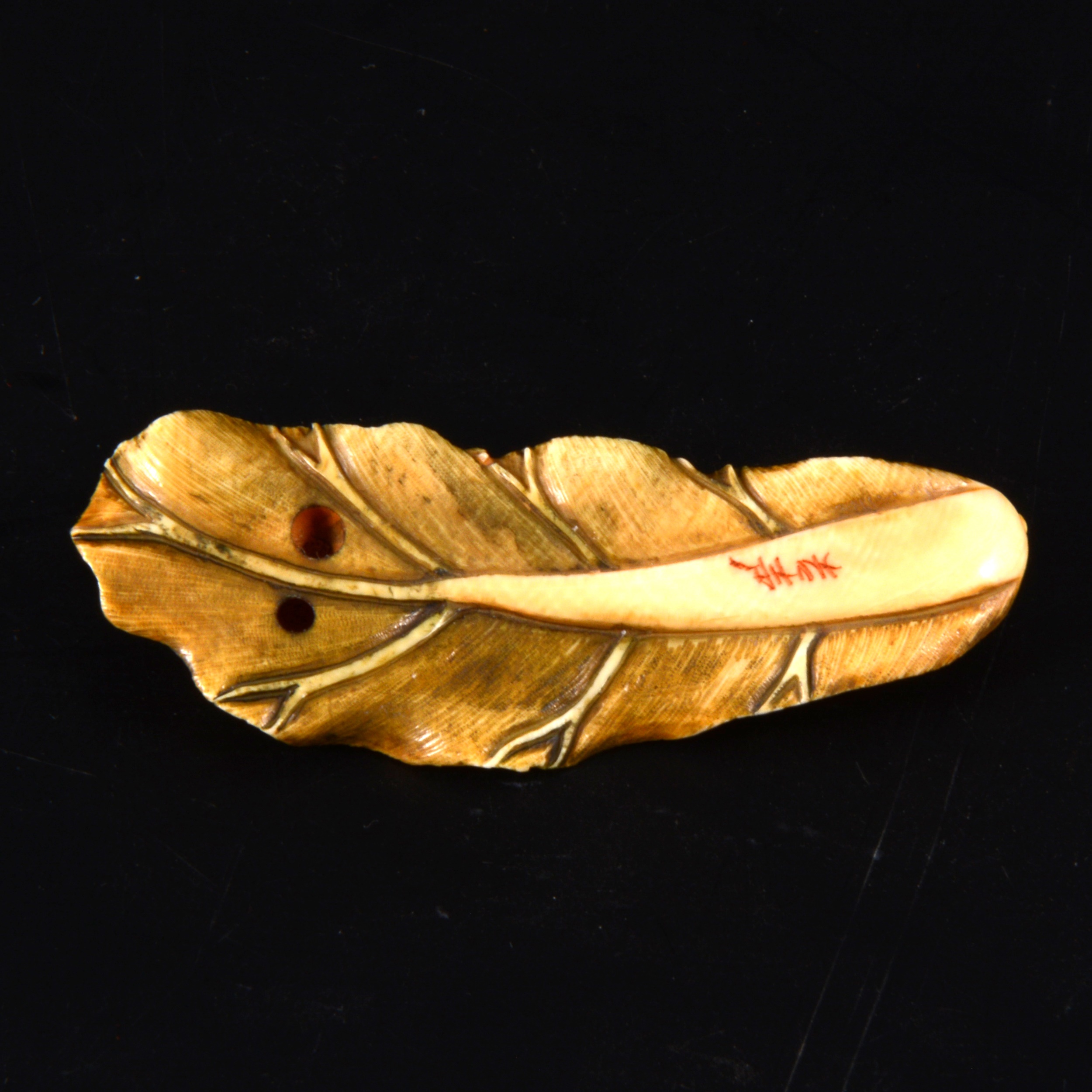 A Japanese carved and stained ivory netsuke, probably early 20th Century - Image 2 of 2