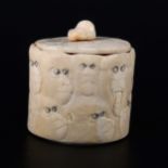 A Japanese carved and stained ivory box, Meiji