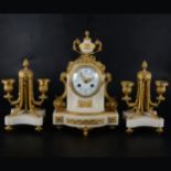 A Louis XV style white marble and gilt metal three-piece clock garniture