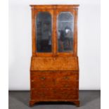 A George II walnut bureau bookcase