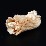 A small Japanese carved ivory okimono, early 20th Century