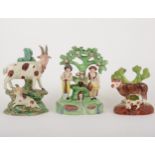 A Staffordshire pearl glazed earthenware group, gardeners by a fountain, early 19th century, and