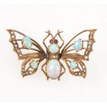 An opal butterfly pendant.