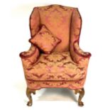 A Georgian style wing-back easy chair,