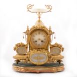 A Louis XVI style gilt metal and alabaster mantel clock, mid 19th century