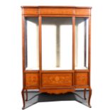 A late Victorian mahogany and marquetry breakfront display cabinet