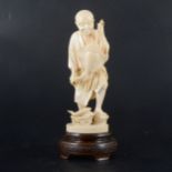 A Japanese carved ivory okimono, Meiji