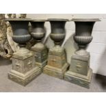 A set of four cast metal campagna shape garden urns, late 20th Century