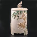 A Japanese carved and stained ivory brush pot, Meiji