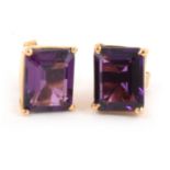 A pair of amethyst stud earrings.