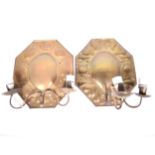 Two similar Arts and Crafts brass wall sconces