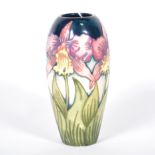 A Moorcroft Pottery vase, 'Orchid' designed by Nicola Slaney