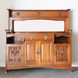 An Arts and Crafts walnut sideboard, by Shapland & Petter of Barnstaple