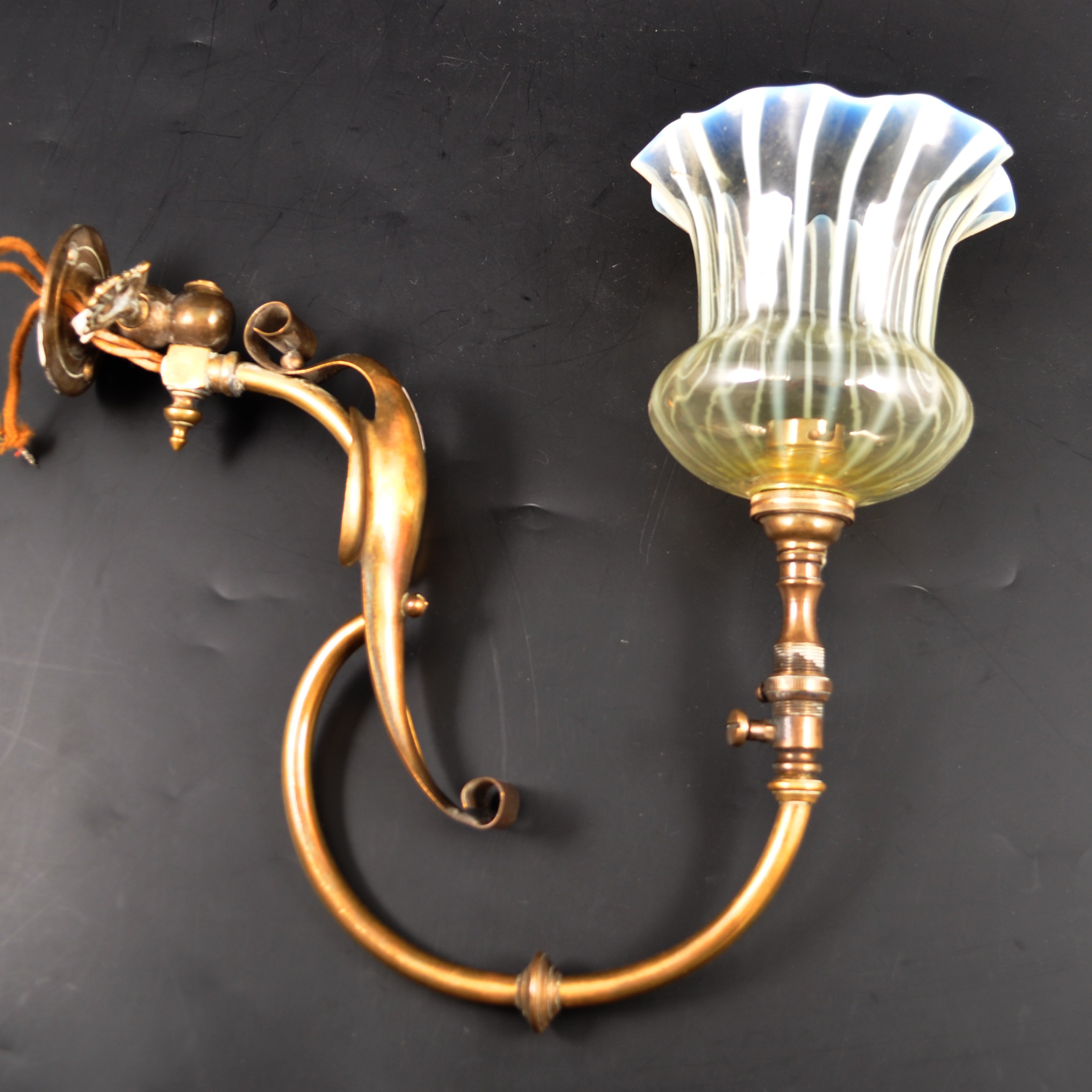 An English Edwardian brass and opalescent glass wall light