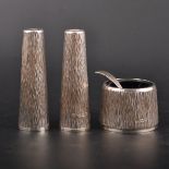 A textured silver three-piece silver condiment set, by C. J. Vander Limited, London 1970