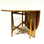 A Norwegian teak drop-leaf dining table, designed by Bendt Winge