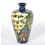 A Moorcroft Pottery vase, 'Wisteria' designed by Philip Gibson for MCC