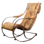 A Victorian wrought iron and leather rocking chair, in the manner of R W Winfield