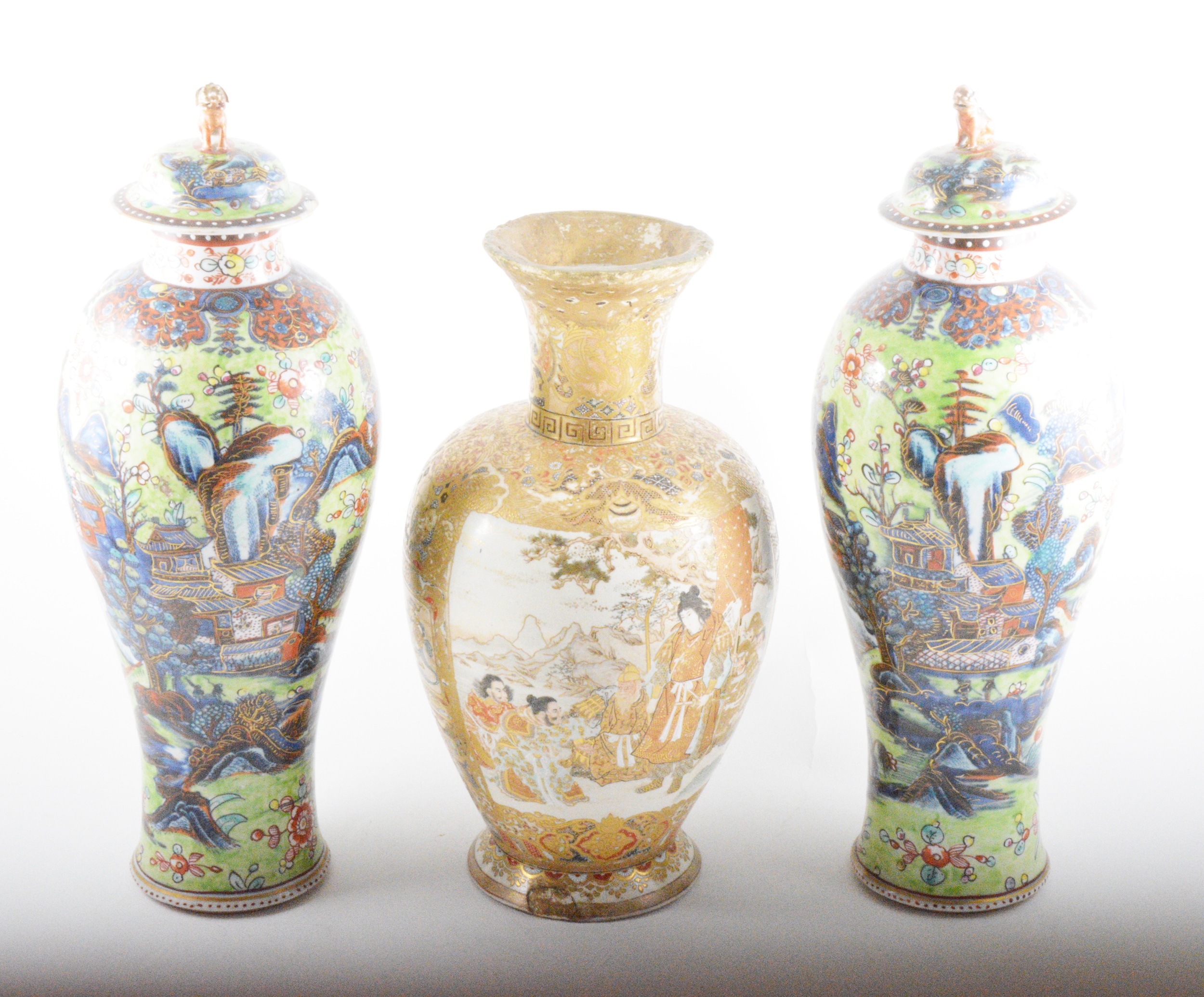 A pair of Chinese covered vases