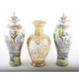 A pair of Chinese covered vases