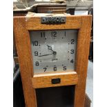 An oak cased electric master clock,