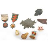 A collection of metal badges, enamel, silver, Russian, etc