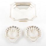 Pair of Edwardian silver scallop shape butter dishes,