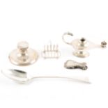 A silver capstan inkwell, toast rack, squat vase, bill clip and serving spoon, cigar lighter