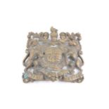 A cast brass plaque, designed as The Royal Arms;