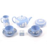 A collection of Wedgwood blue jasperware, including a teapot, 13cm.