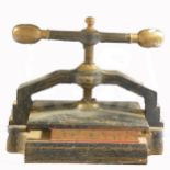 A Victorian cast metal book press, width 53cm.