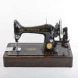 A Singer hand sewing machine, cased.