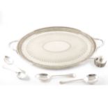 A silver-plated oval twin handled tea tray by Roberts & Belk, spoons, and a set of silver apostle