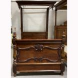 A Victorian mahogany half tester bed
