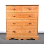 A pine chest of drawers