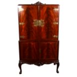 A reproduction mahogany finish cocktail cabinet,