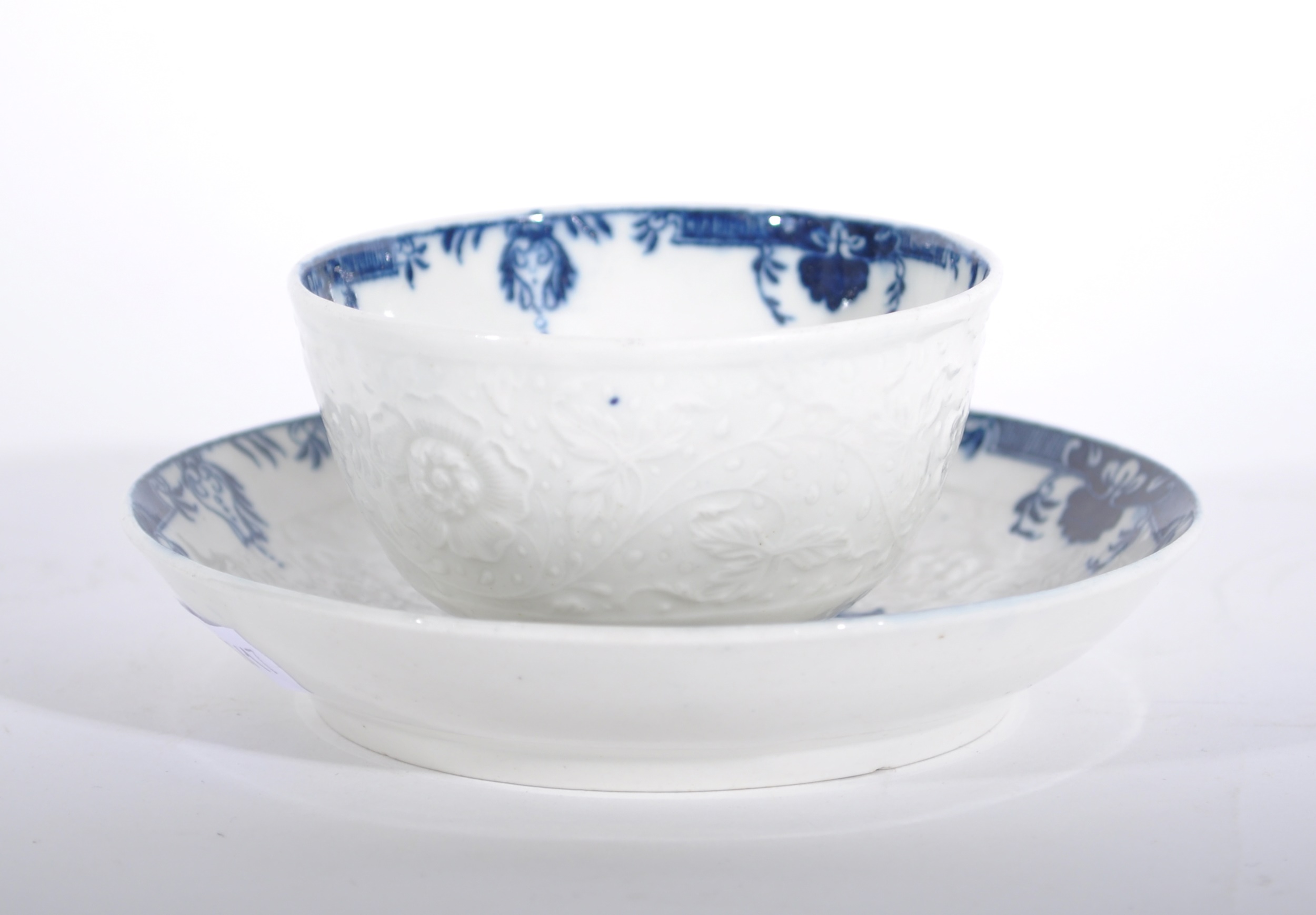 A Caughley blue and white moulded tea bowl and saucer,