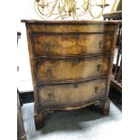 A George II style walnut serpentine front chest of drawers,